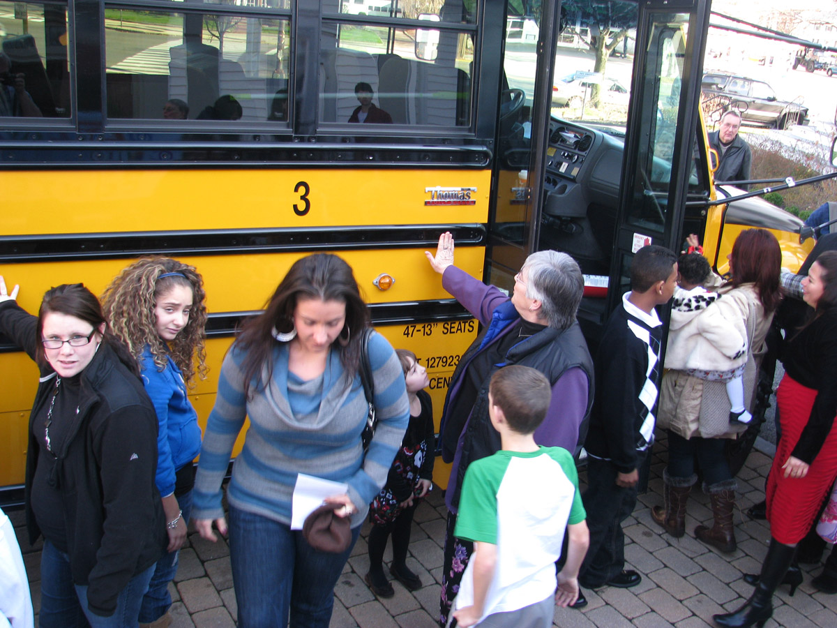 bus07 Rev. Christine and a few others standing in front of bus